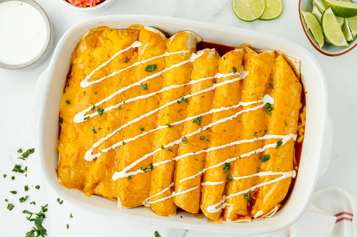 overhead shot of smothered beef burritos in pan