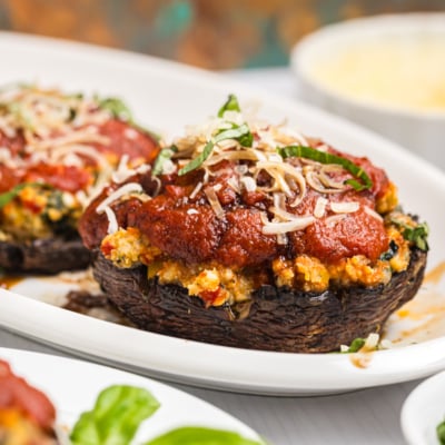 close up straight on shot of stuffed mushroom on platter
