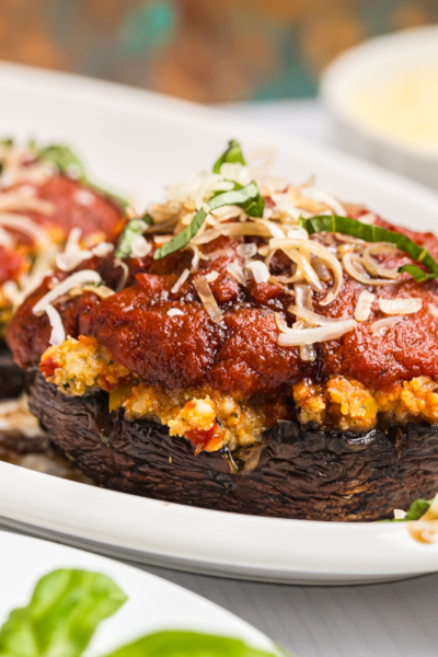 close up straight on shot of stuffed mushroom on platter