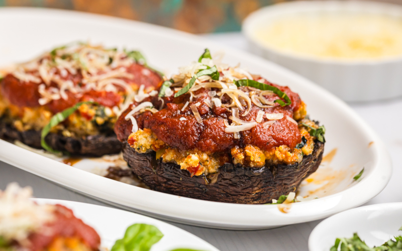close up straight on shot of stuffed mushroom on platter