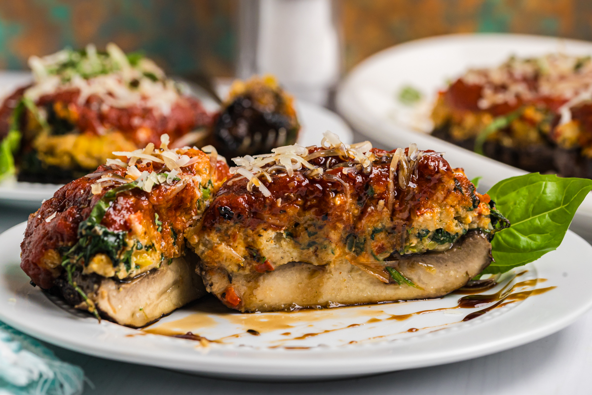 stuffed portabella mushroom cut in half on plate