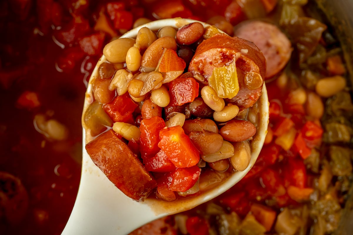 overhead shot of ladle full of 15 bean soup