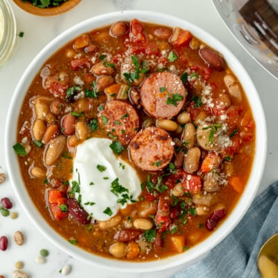 overhead shot of bowl of soup topped with sour cream