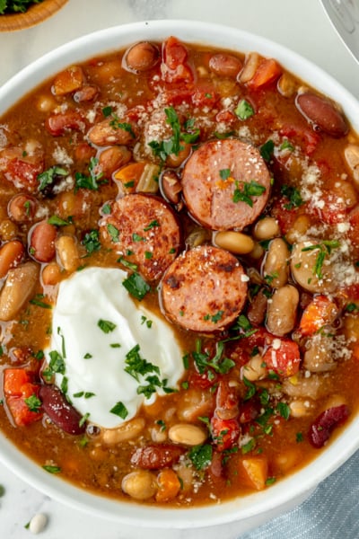 overhead shot of bowl of soup topped with sour cream