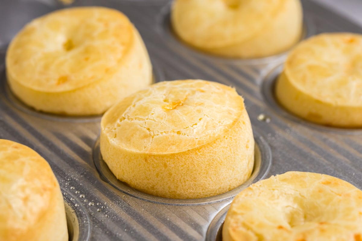 close up angled shot of fogo de chao rolls in pan