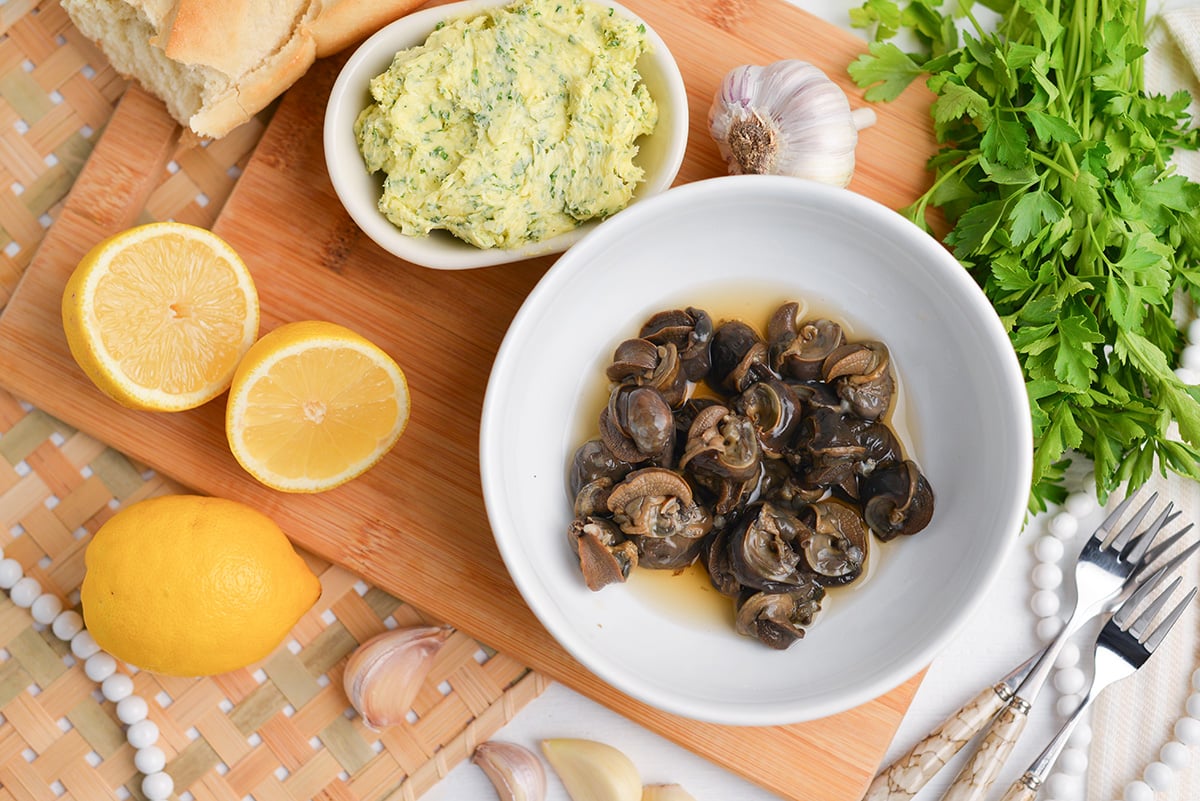 garlic parsley butter and escargots soaking in brandy