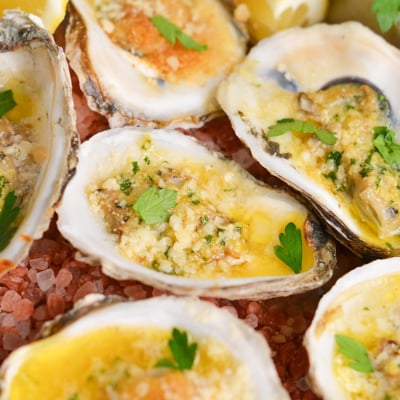 close up angled shot of garlic butter baked oysters