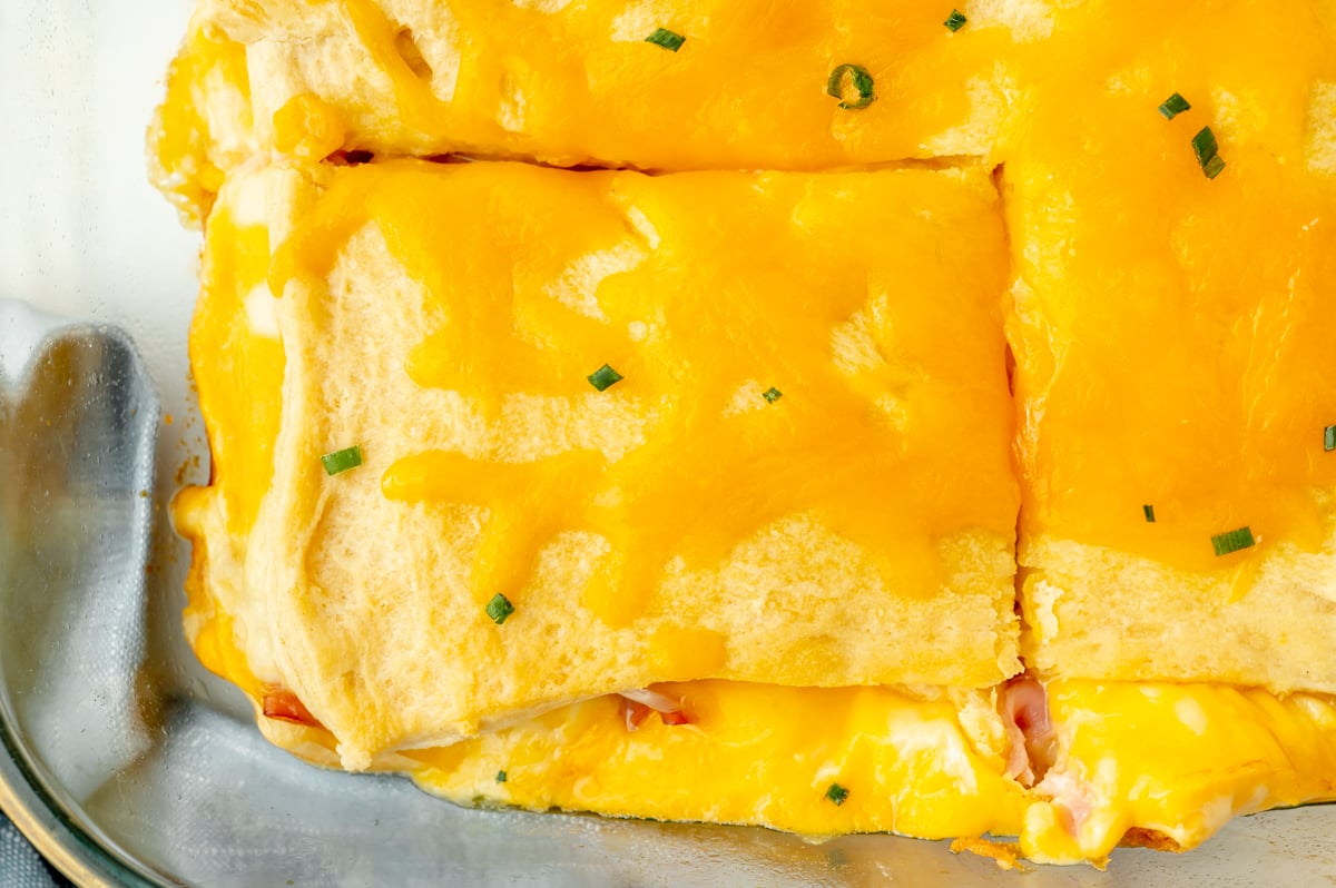 overhead shot of slice cut from ham and cheese casserole