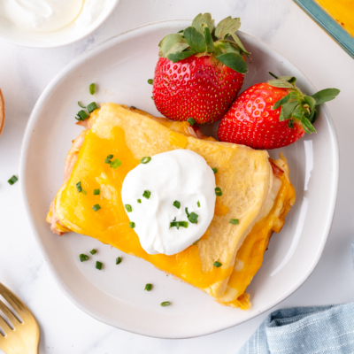 overhead shot of slice of casserole on plate with strawberries