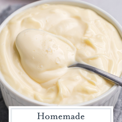 angled shot of spoon in bowl of homemade aioli with text overlay