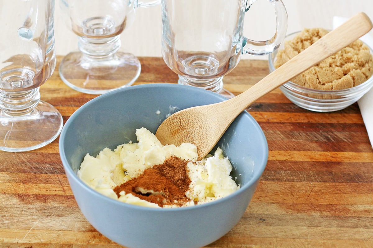 spiced butter ingredients in bowl with wooden spoon