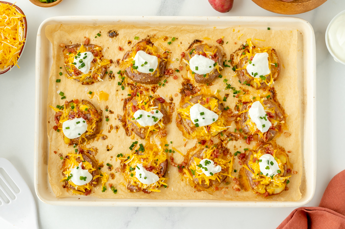 overhead shot of loaded potatoes on sheet pan
