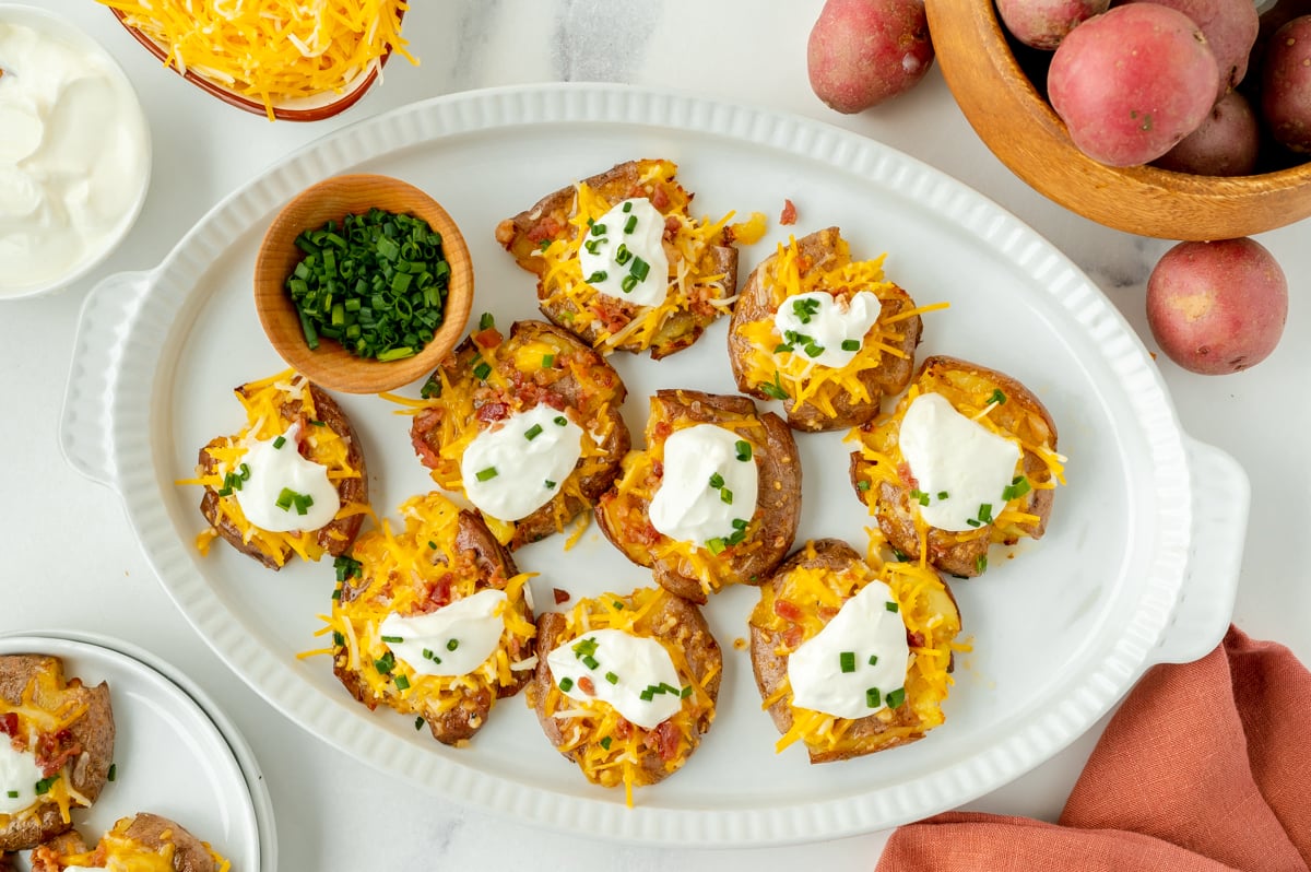 overhead shot of platter of loaded smashed potatoes