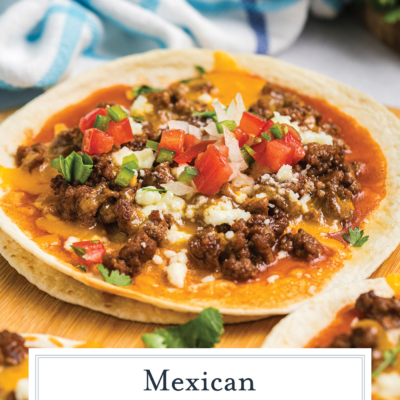 angled shot of mexican pizza on wooden board with text overlay