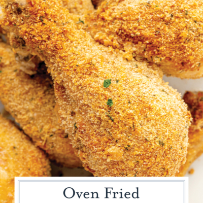 angled shot of oven fried chicken with text overlay