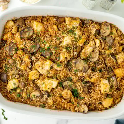 overhead shot of baking dish of stick of butter chicken and rice