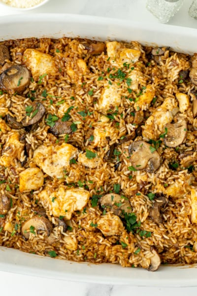 overhead shot of baking dish of stick of butter chicken and rice