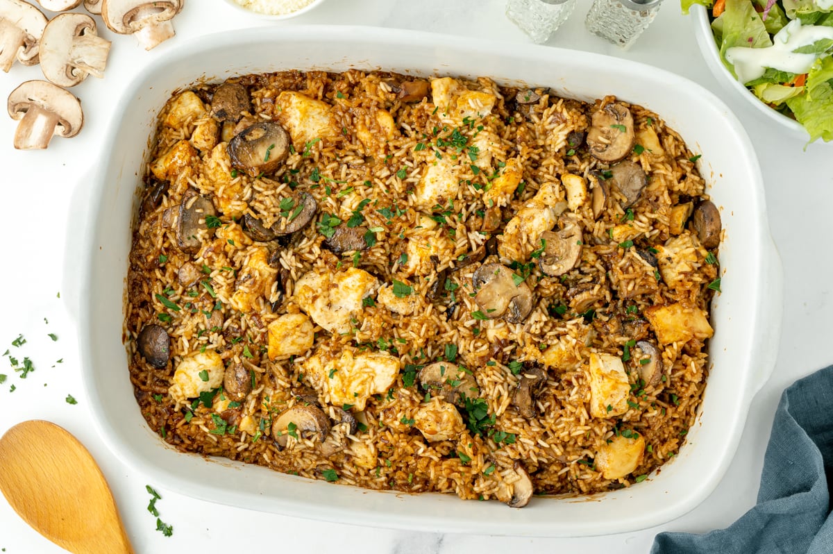 overhead shot of baking dish of stick of butter chicken and rice