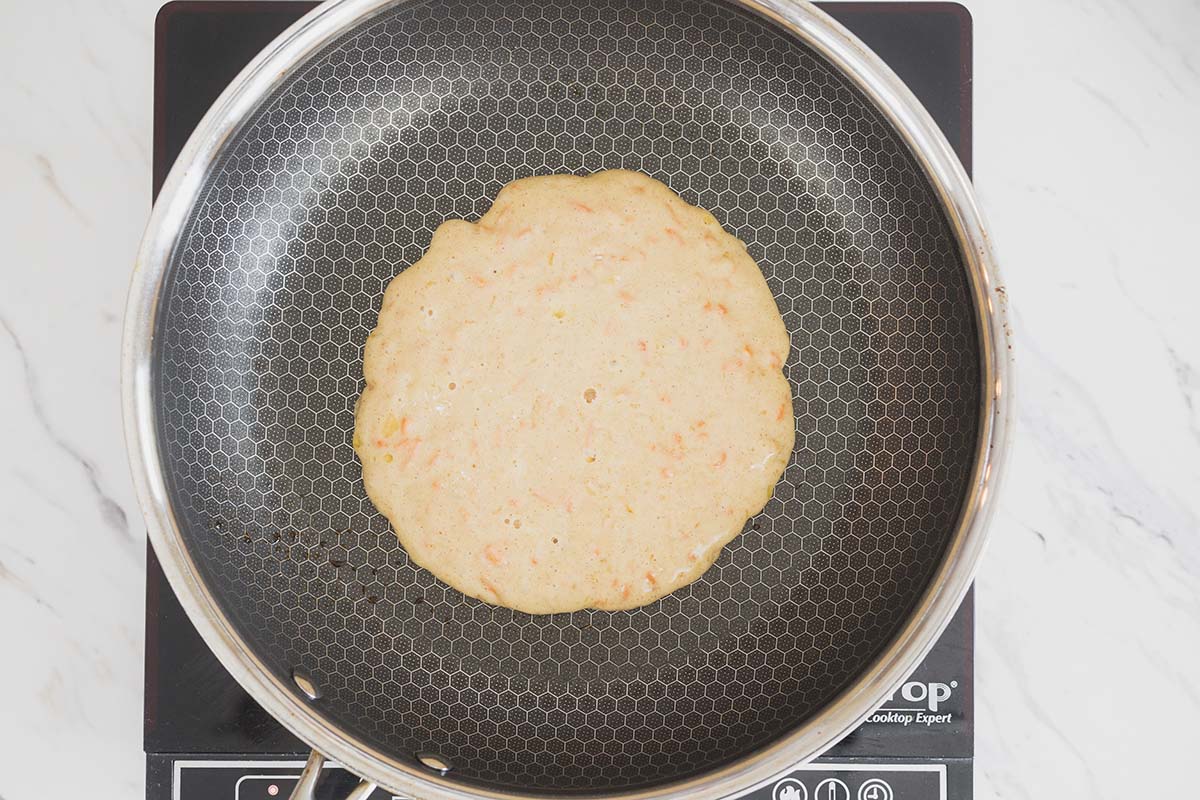 overhead shot of pancake batter in pan