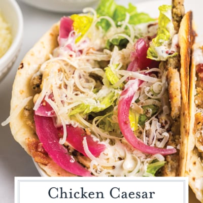 angled shot of chicken caesar smash taco on plate with text overlay