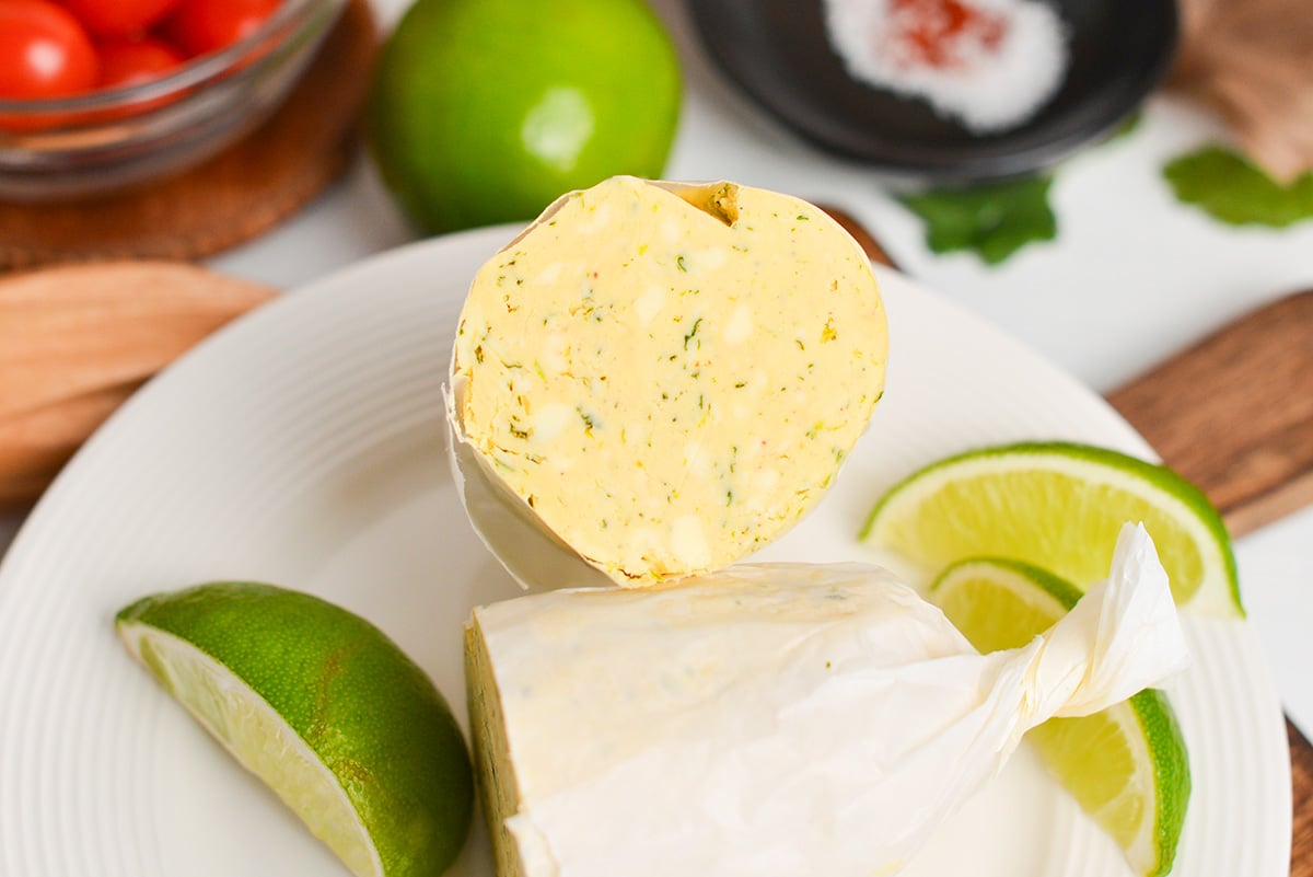 close up of roll of flavored butter cut in half