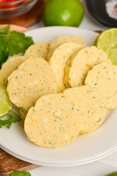 angled shot of plate of slices of flavored butter