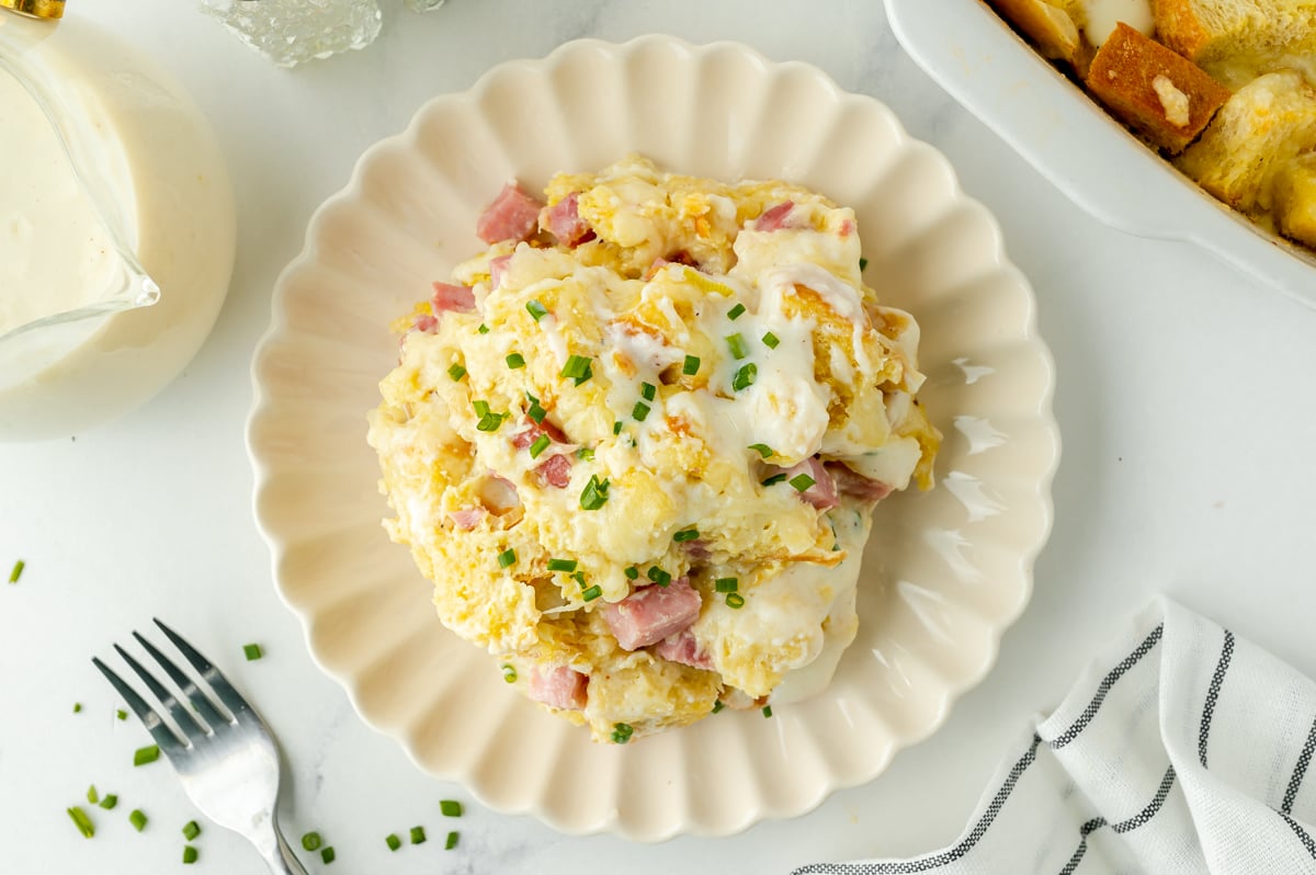 overhead shot of scoop of croque monsieur casserole on plate