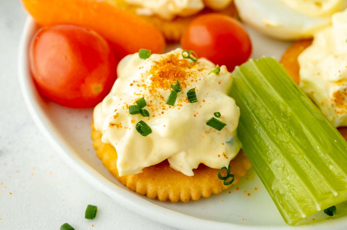 close up shot of creamy dip on cracker