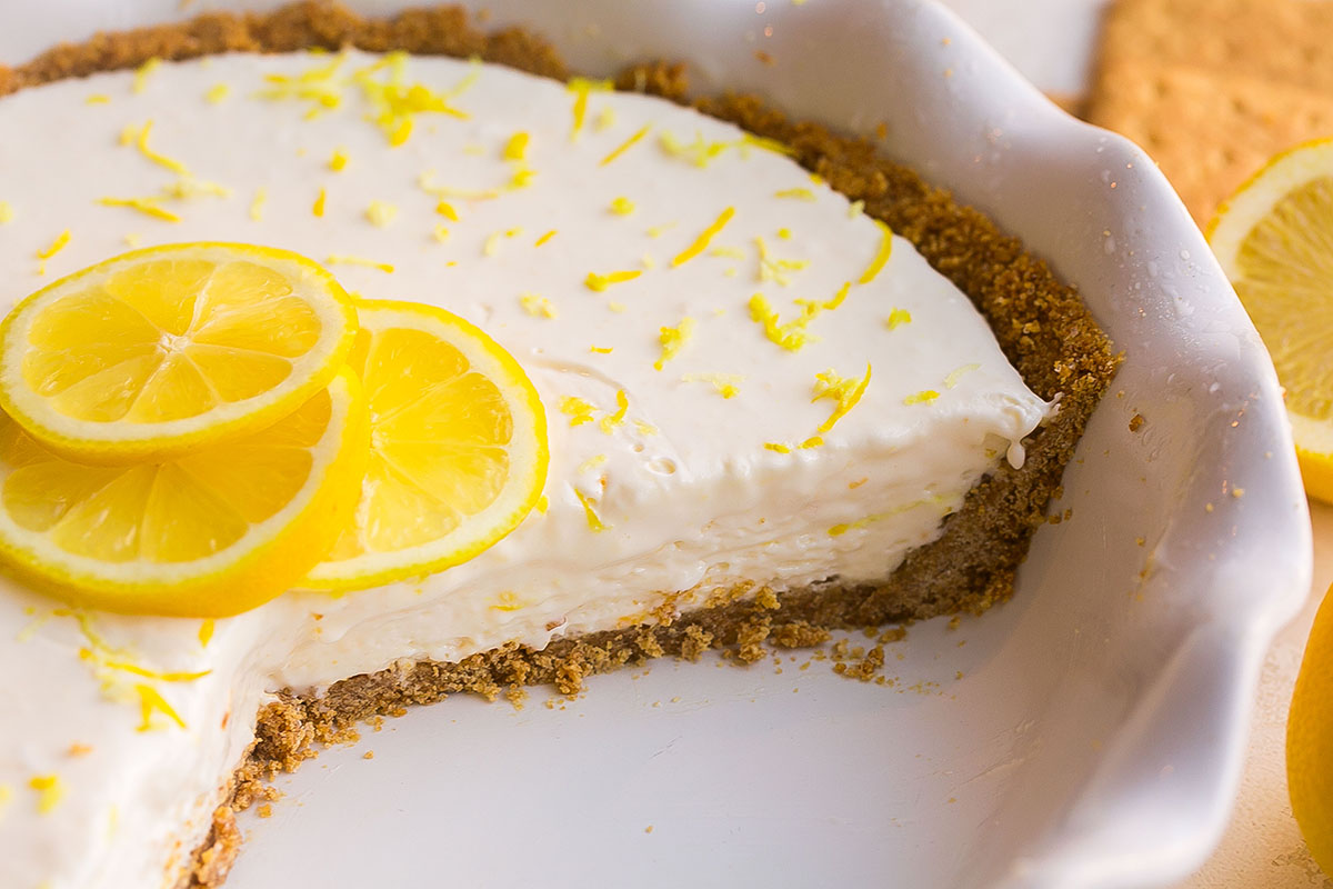 close up of slice taken out of lemon pie