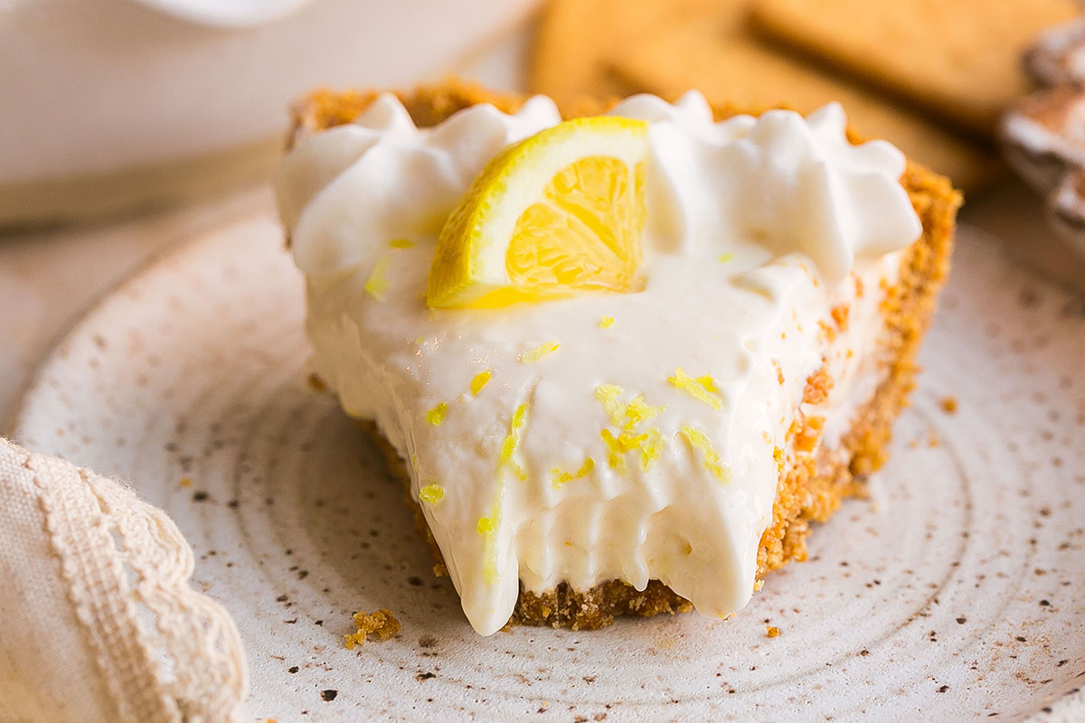 close up shot of bite taken out of frozen lemonade pie