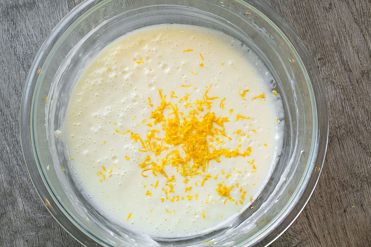overhead shot of pie filling in bowl with lemon zest