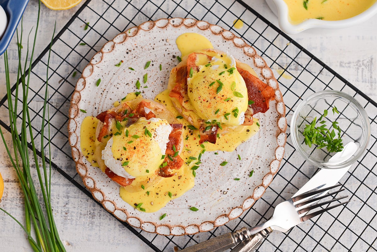 overhead shot of eggs benedict topped with blender hollandaise sauce