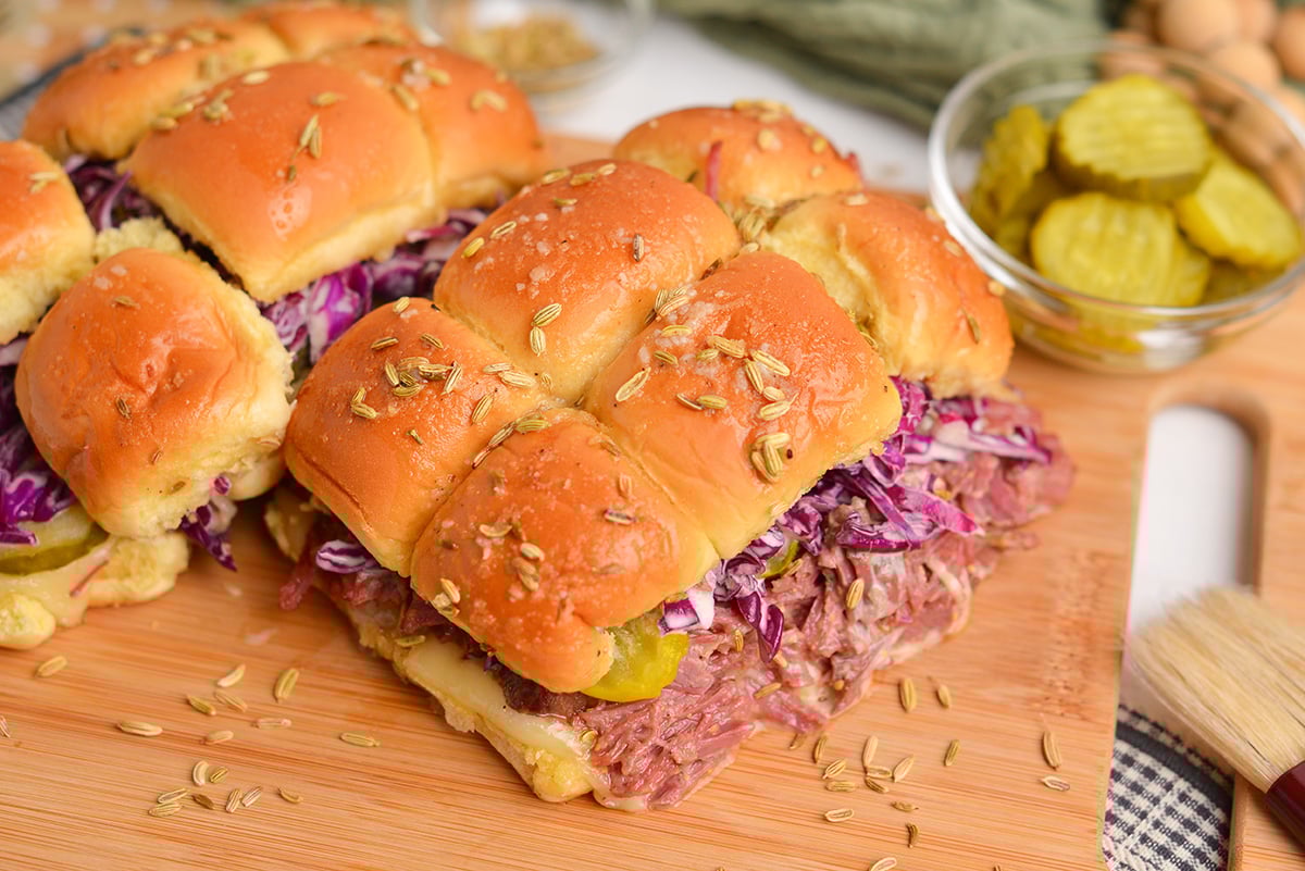 angle view of corned beef sandwich with red cabbage slaw and fennel seeds