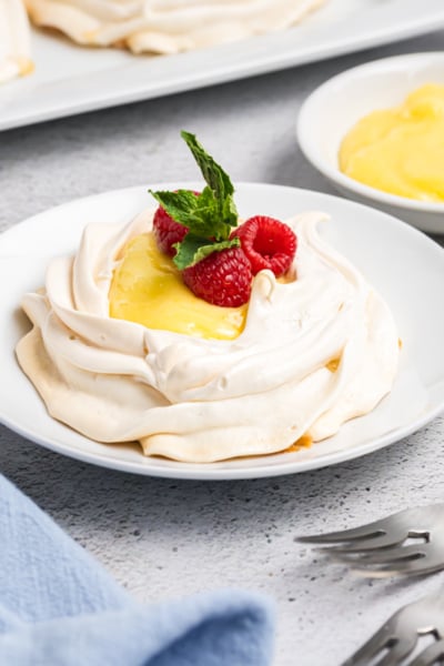 angled shot of lemon curd meringue on plate