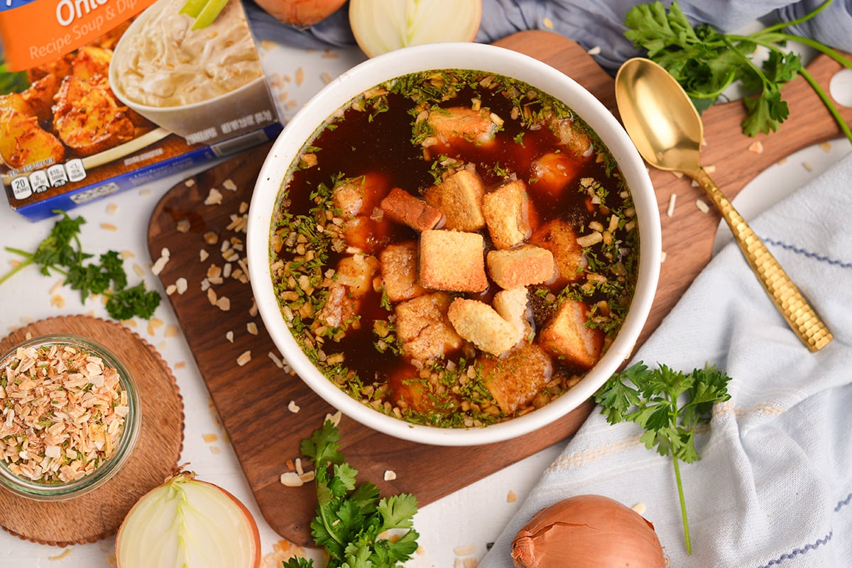 Homemade onion soup mix stirred into broth with croutons and cheese