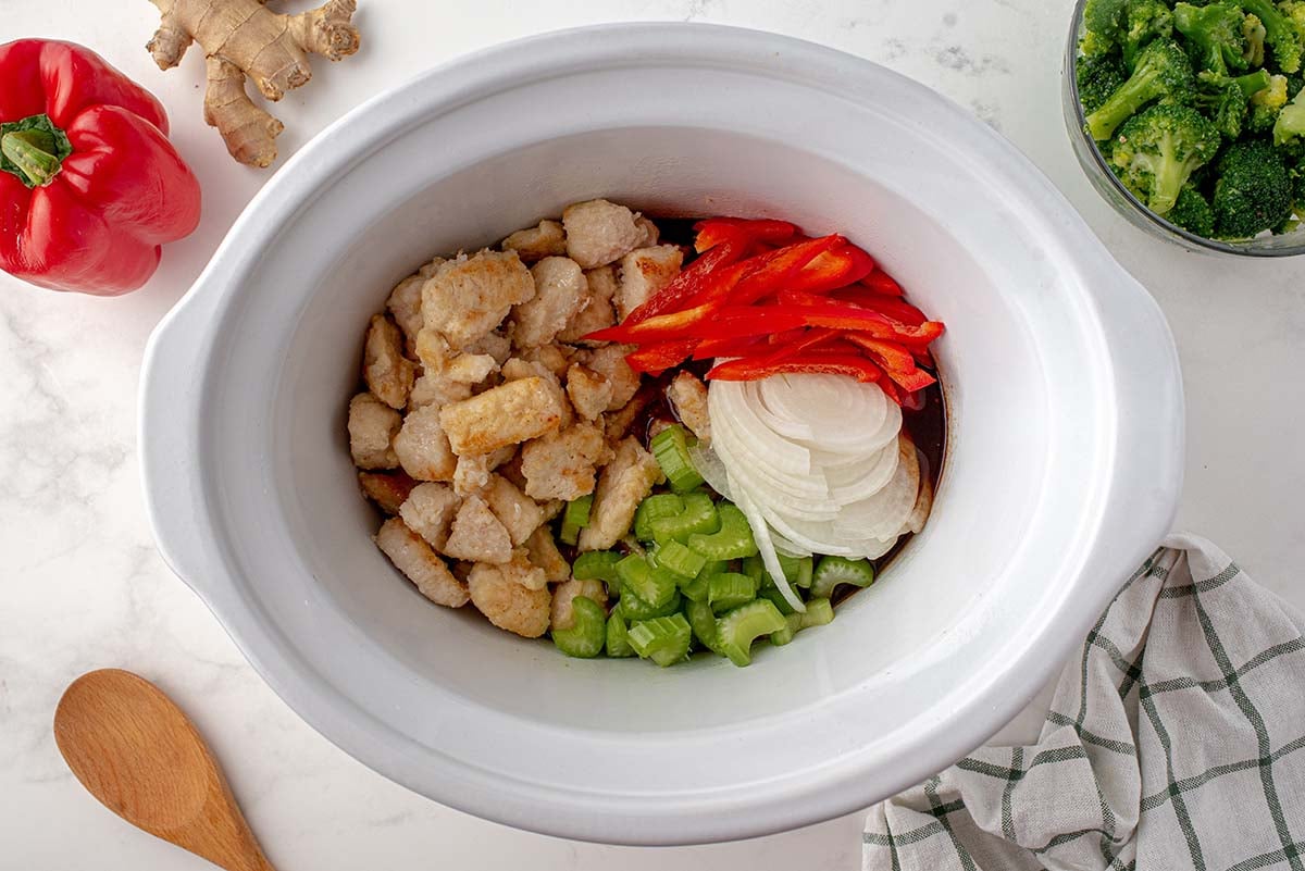 overhead shot of slow cooker cashew chicken ingredients in slow cooker