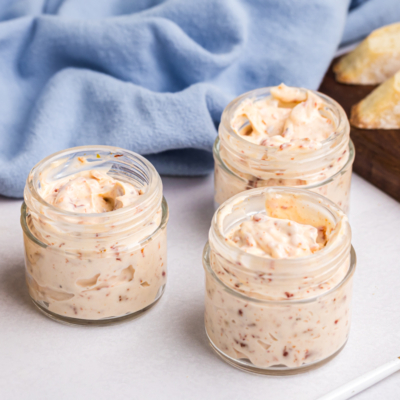 angled shot of three jars of sun dried tomato aioli