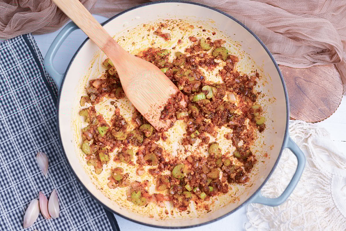 holy trinity and spice mixture blooming in a skillet