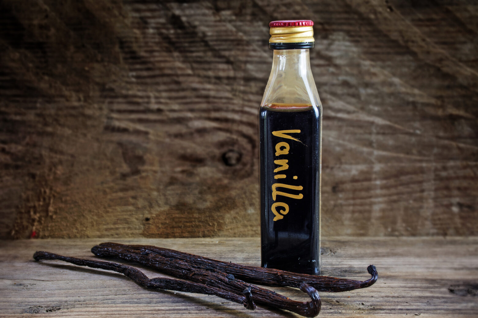 bottle of homemade vanilla extract with vanilla beans