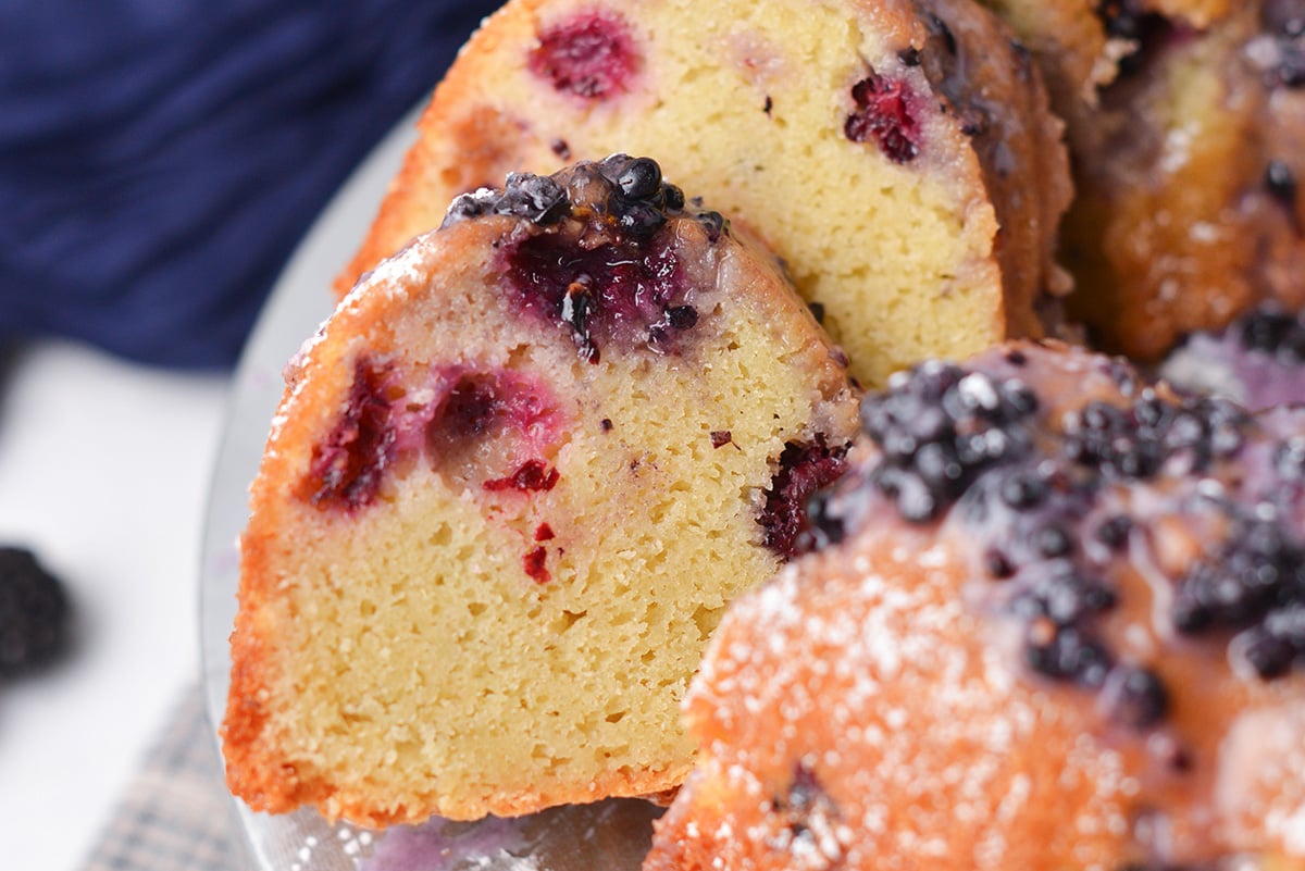 close up of a slice of blackberry cake with buttermilk