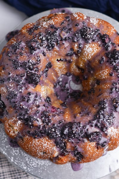 Blackberry bundt cake served in slices with glossy blackberry glaze