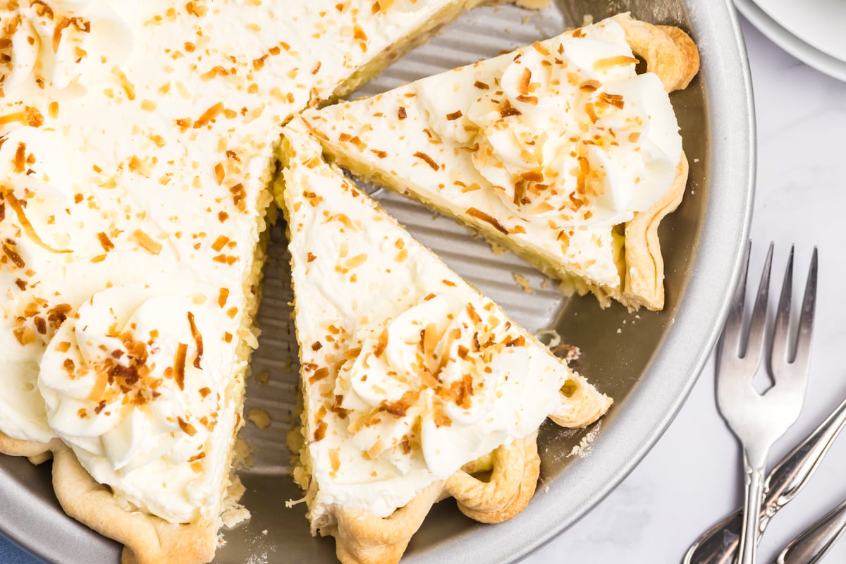 overhead shot of sliced coconut cream pie