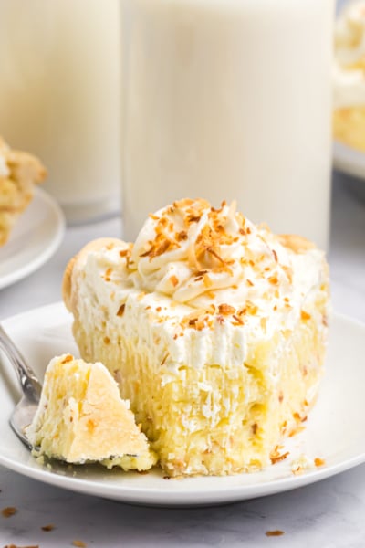 fork with bite taken from slice of pie