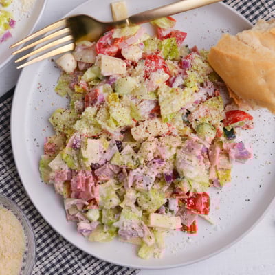 close up of grinder salad with pepperoncini and deli meats