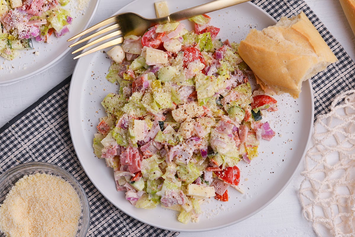 close up of grinder salad with pepperoncini and deli meats