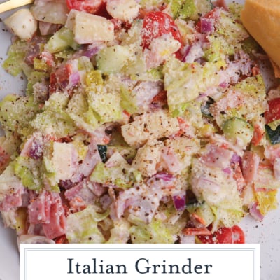grinder salad recipe with iceberg lettuce salami provolone and creamy dressing with text overlay