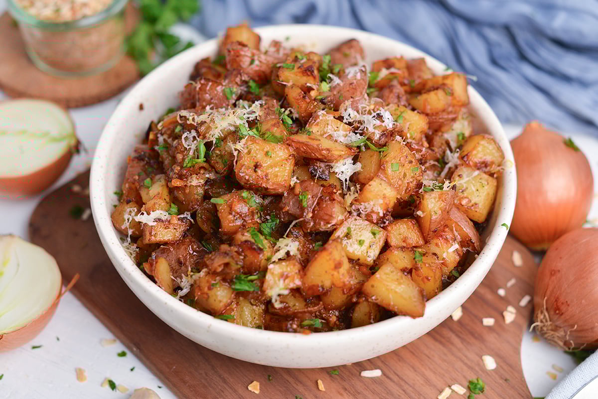 crispy onion soup potatoes served in white bowl