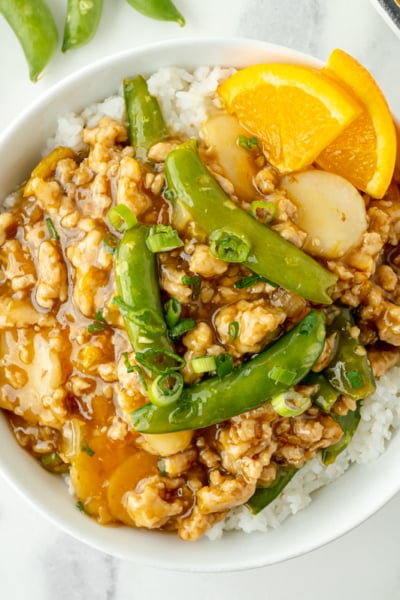 overhead shot of ground orange chicken bowl