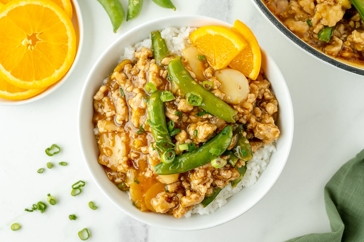 overhead shot of ground orange chicken bowl
