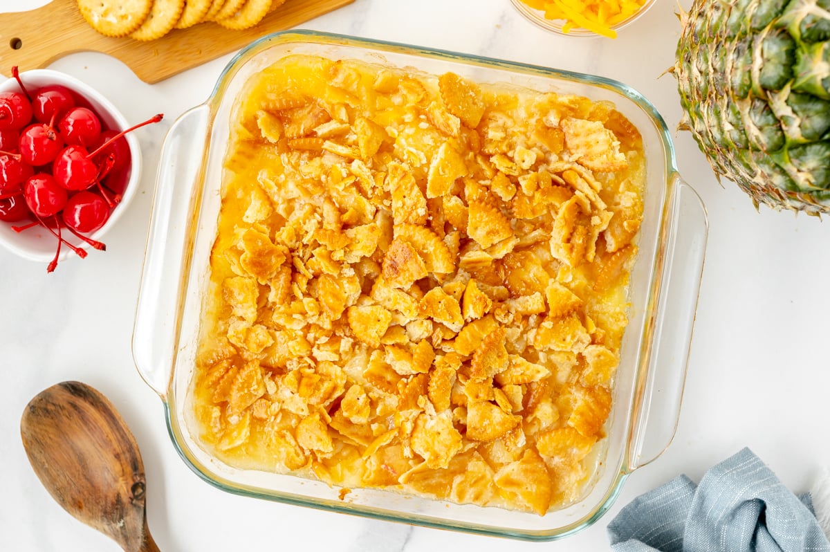 Pineapple casserole baked with buttery Ritz cracker topping in white casserole dish